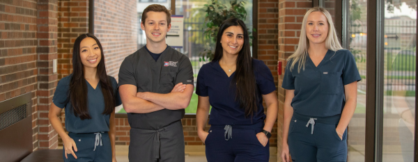 Four dental providers standing in a group.